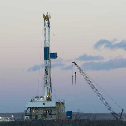Drilling Rig in the Evening in the Basin